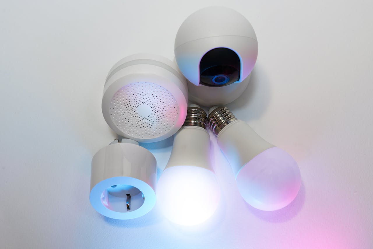 A collection of smart home devices including light bulbs, a security camera, and a smart hub.